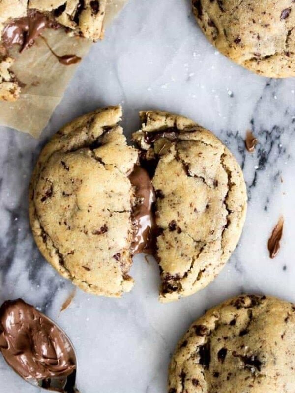 Overhead of nutella stuffed cookie broken in half with nutella filling