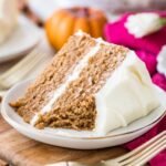 Two-layer slice of spice cake missing one bite.