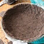 Overhead view of an Oreo crust that's been pressed into a glass pie plate.