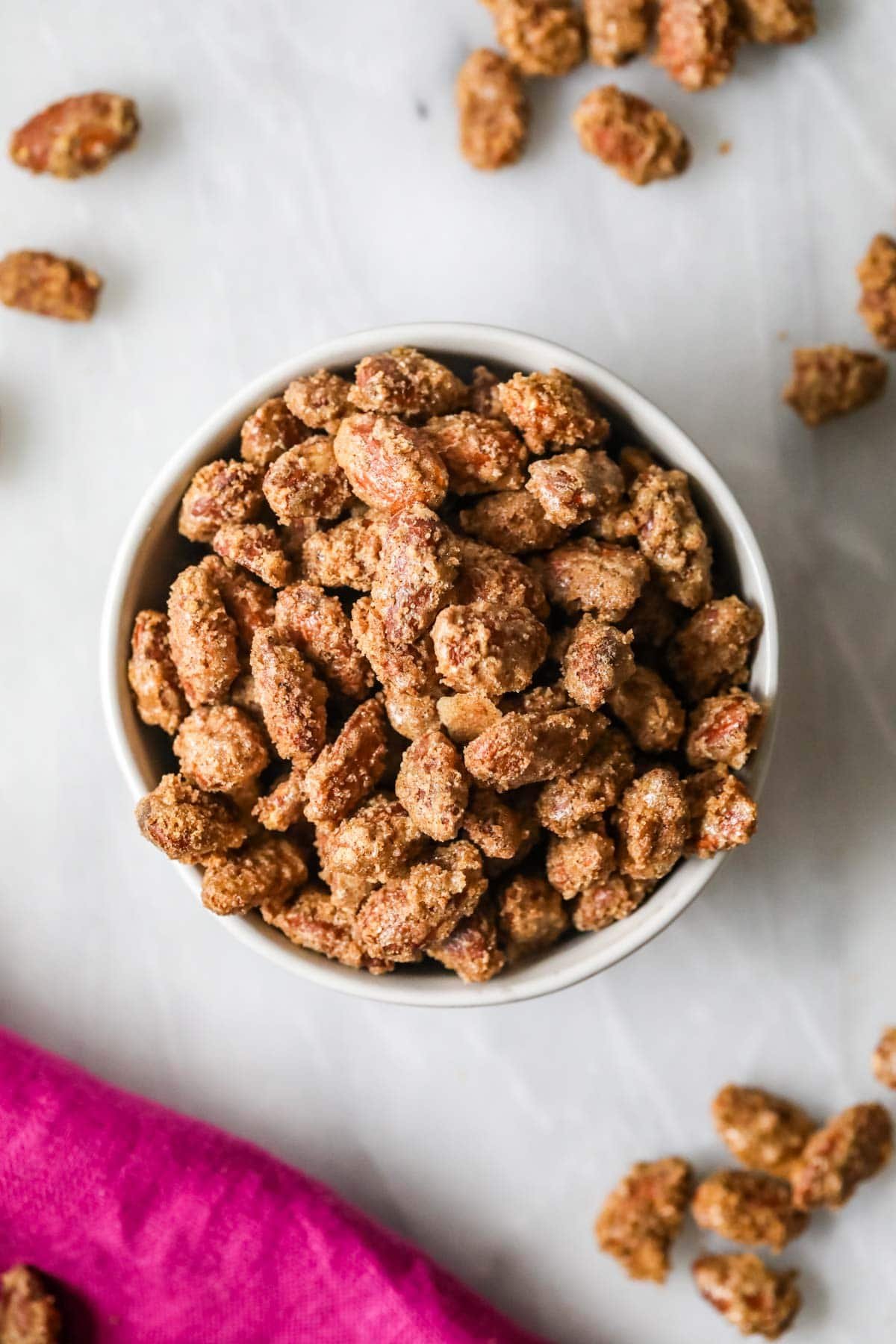 Overhead view of a bowl of candied almonds.