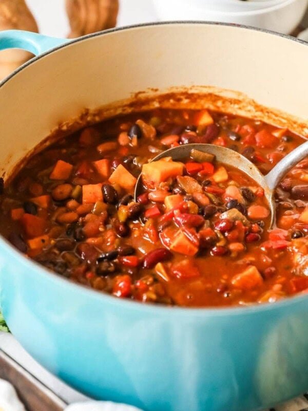 Pot of vegetarian chili made with sweet potato, beans, and more.