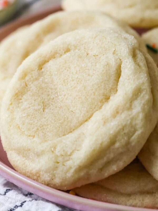 Thick and soft gourmet sugar cookies that have been rolled in sugar before baking.
