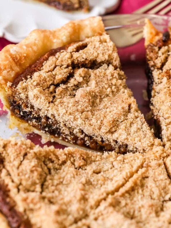 Shoofly pie that's been cut into slices in a pie plate.